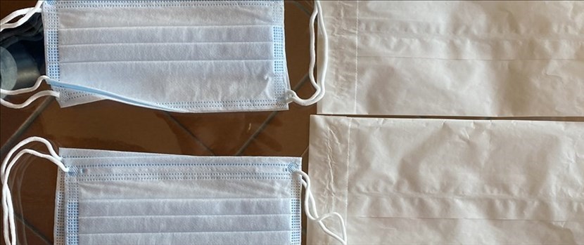 Mascherine consegnate in buste di carta aperta